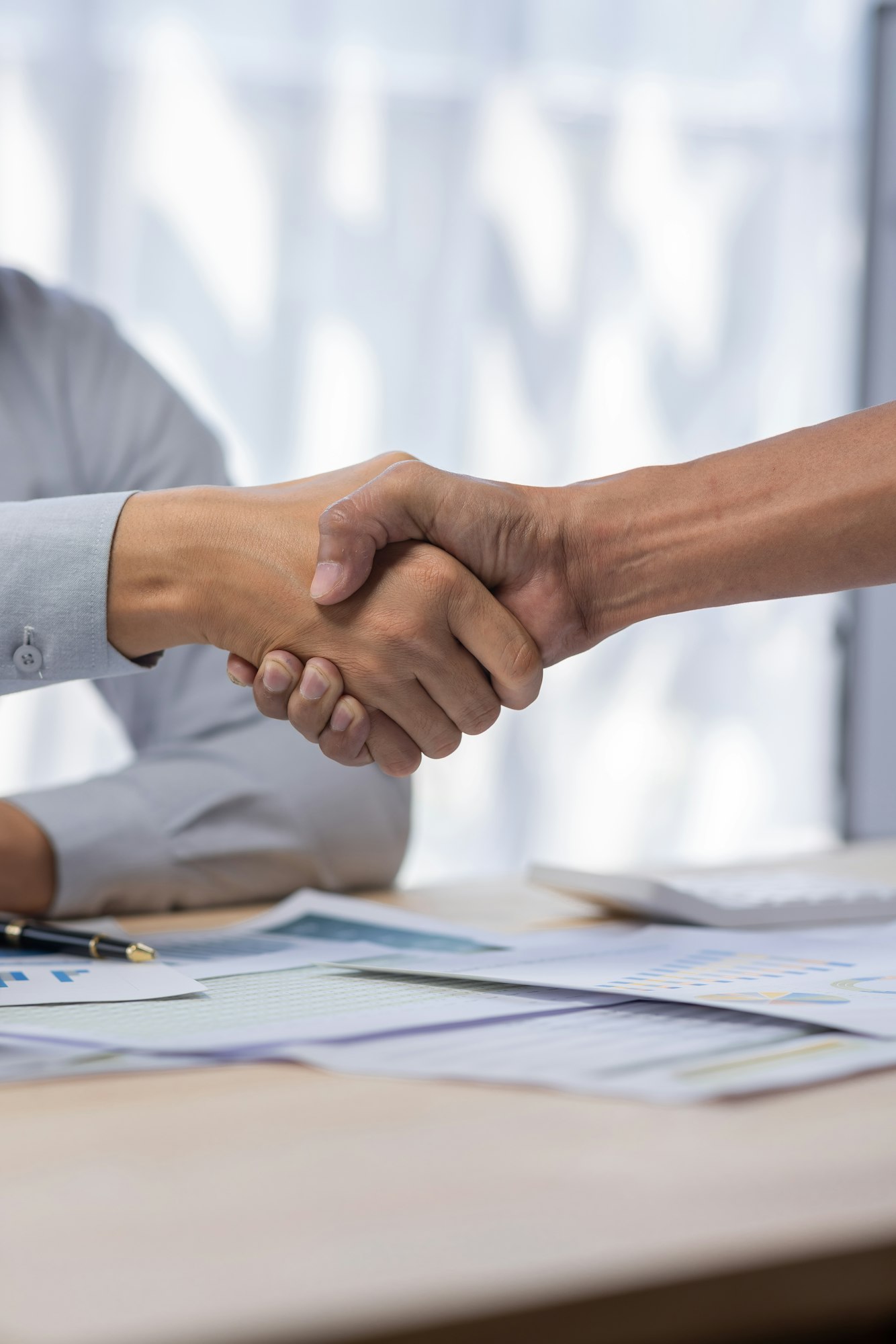 Business man offer and give hand for handshake in office. Successful job interview. Apply for loan
