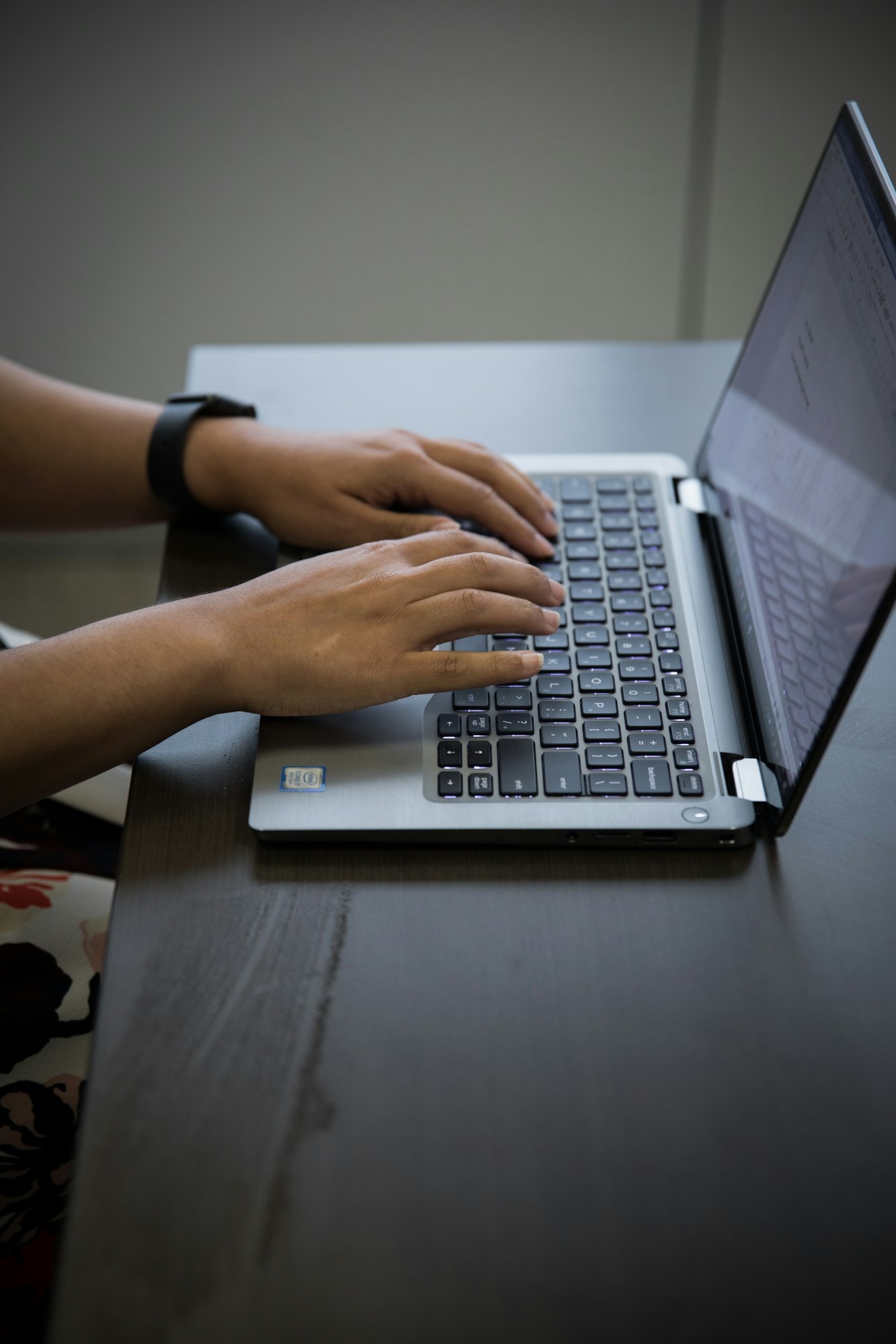 Laptop on work desk in corproate office woman typing hand